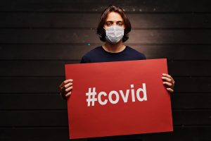 man holding a placard