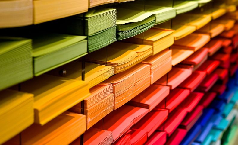 multi colored folders piled up