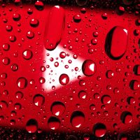 water droplets on red surface