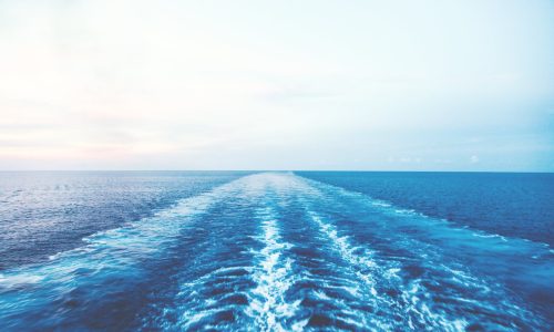 blue body of water under clear blue sky