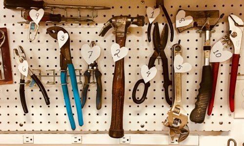 handheld tools hang on workbench