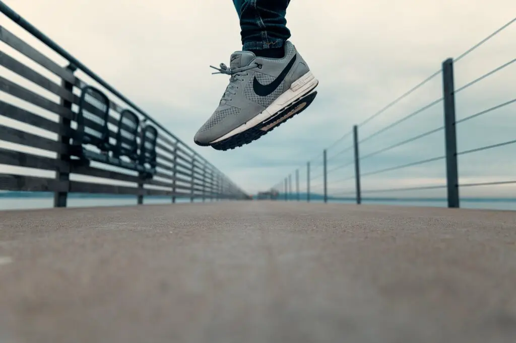 person wearing gray nike shoes